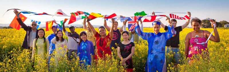 International students with flags in a field