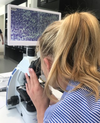 Lady using microscope